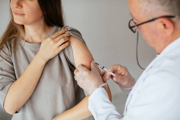 istock Young women receiving coronavirus vaccine 1296328084
