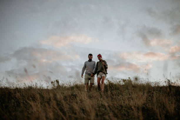 istock Enjoying a spontaneous walk down the countryside road down the small hills 1296333614