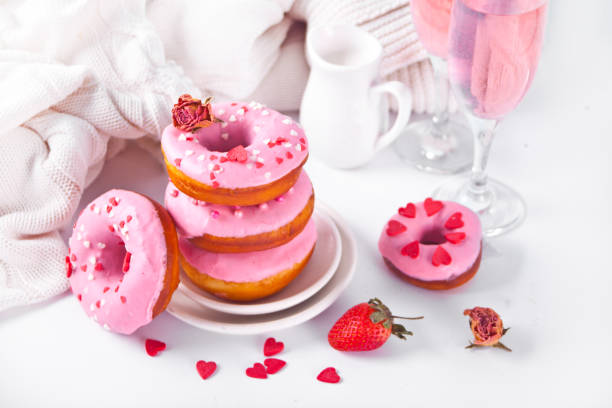 istock Stack of pink doughnuts on the plate. Valentine's Day concept. 1296333877