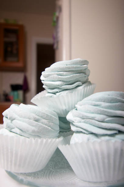 istock Homemade marshmallow sprinkled with icing sugar. Dessert lies on the table surface. Close-up shot. 1296334066