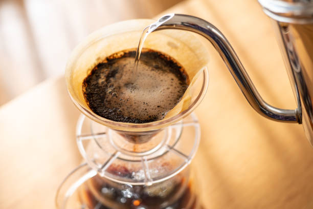 istock Pour over coffee brewing in living room 1296334925