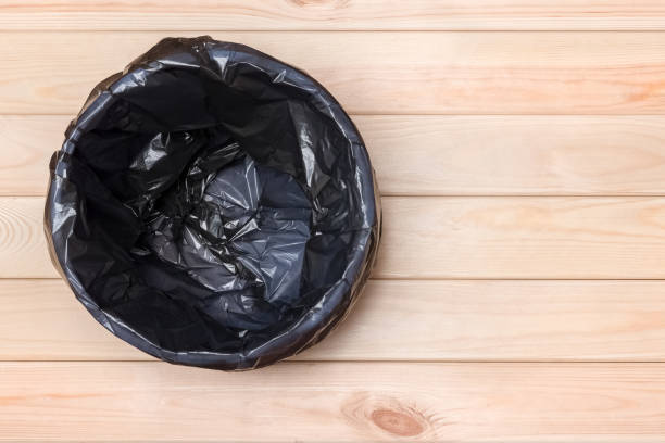 istock Empty Bin on Wooden Background. Trash Can Top View. Garbage Basket. Rubbish Black Bag in a Trash Can. Empty Rubbish Bin. Waste Can with Plastic Package. Empty Garbage Bin. Bin on Wooden Floor. Trash 1296337957