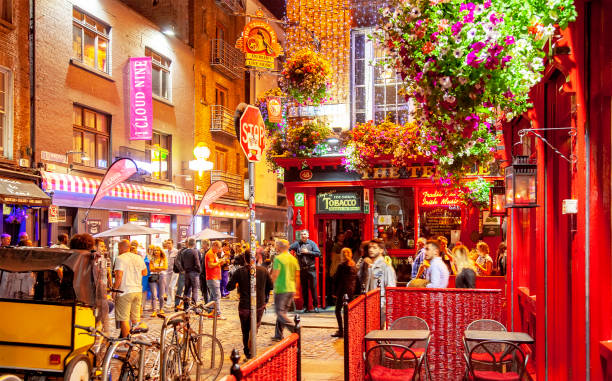 Nightlife around Temple Bar area in Dublin, Ireland Dublin, Ireland - June 2020: Night life around Temple Bar area - most popular touristic place temple bar pub stock pictures, royalty-free photos & images