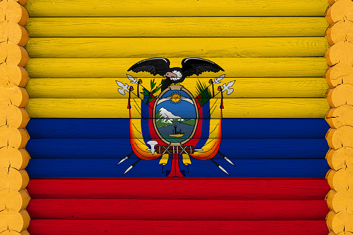 National flag  of  Ecuador on a wooden wall background. The concept of national pride and a symbol of the country. Flags painted on a house