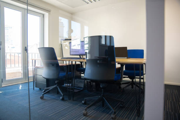 istock Empty meeting room behind glass wall 1296339436