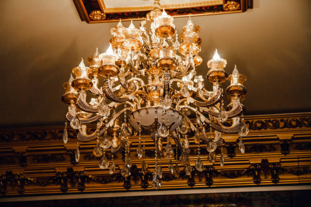 istock Luxury interior chandelier has light candles. 1296339728