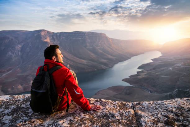istock Climber watching the sunset view on the top of mountain 1296340977