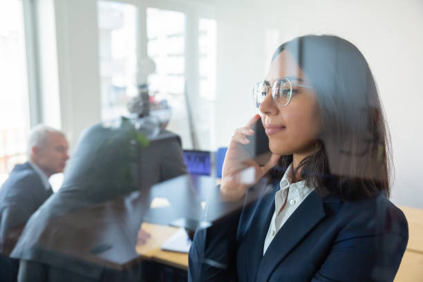 istock Confident office professional in suit and glasses 1296341281