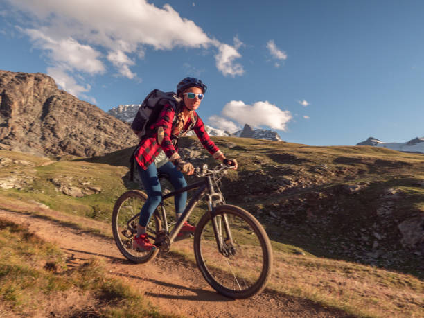 istock Mountain biker on dirt trail, Switzerland 1296342180