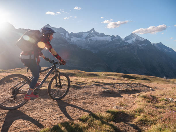 istock Mountain biker on dirt trail, Switzerland 1296342193