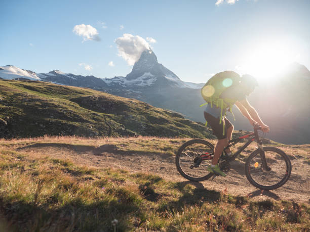 istock Mountain biker on dirt trail, Switzerland 1296342354