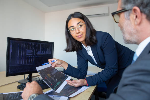 istock Boss and financial expert discussing trading strategy 1296342370