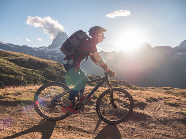 istock Mountain biker on dirt trail, Switzerland 1296343913
