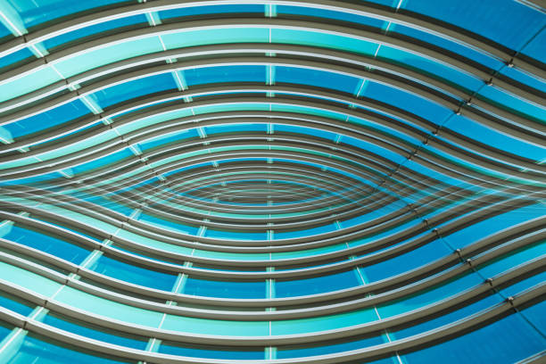 istock underside panoramic and perspective view to steel blue glass high rise building skyscrapers, business concept of successful industrial architecture 1296343923
