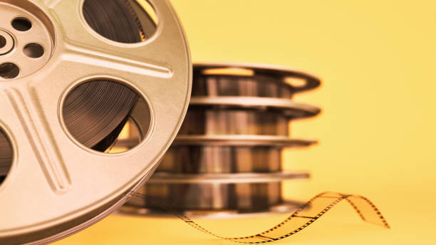 istock 35mm film strip Yellow Background 1296345377
