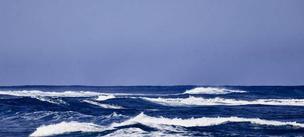 istock Blue wave, Clear water and spray on the Atlantic ocean 1296347512