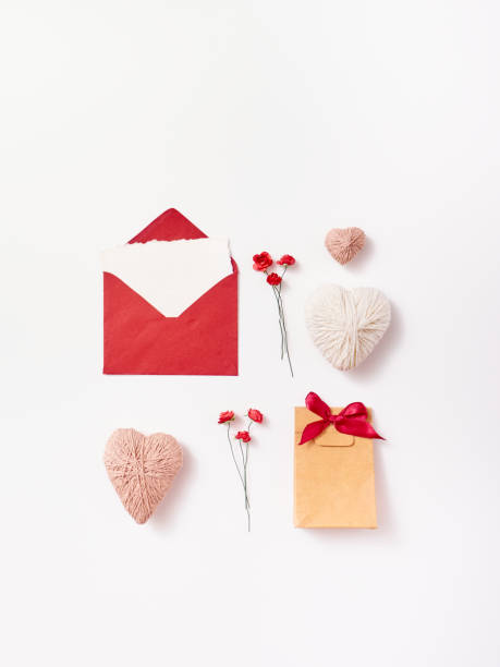 istock Composition of envelope, gift, hearts, roses and feather for greeting card 1296348303