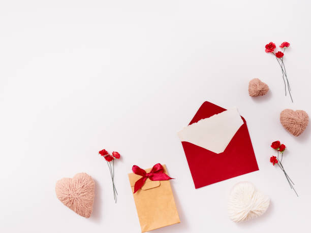 istock Composition of envelope, gift, hearts, roses and feather for greeting card 1296348572
