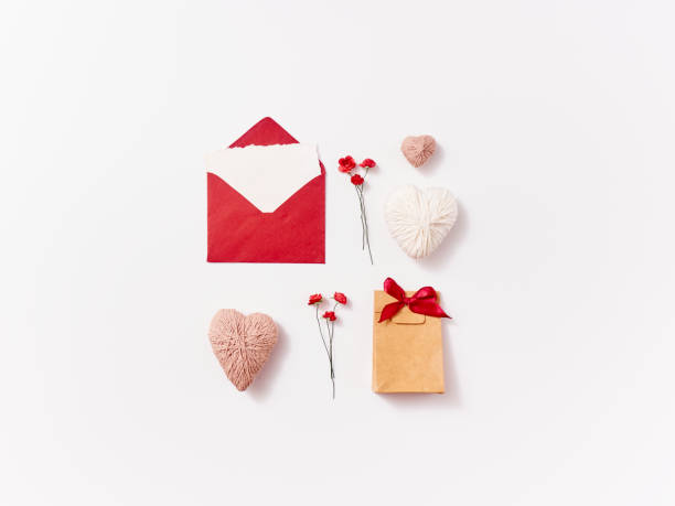 istock Composition of envelope, gift, hearts, roses and feather for greeting card 1296348586