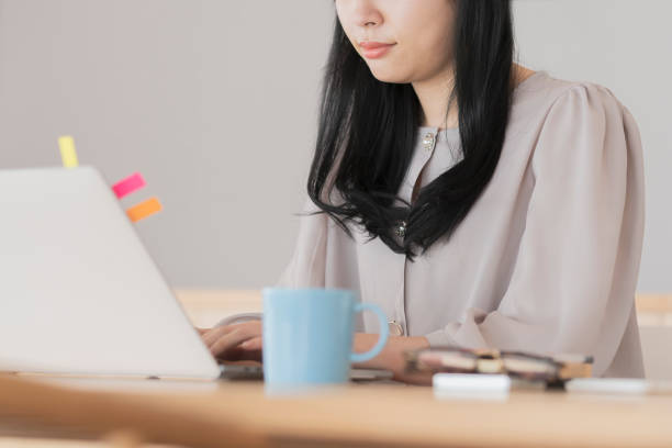 istock Asian woman working from home 1296351727