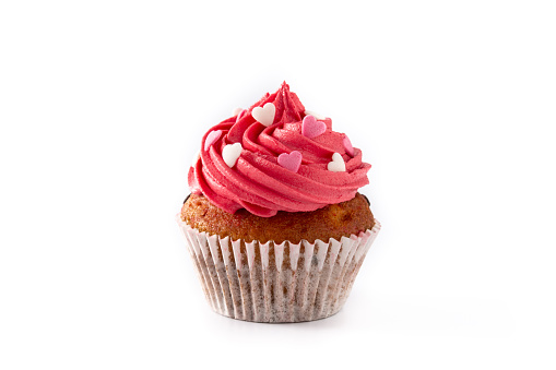 Cupcake decorated with sugar hearts for Valentine's Day isolated on white background