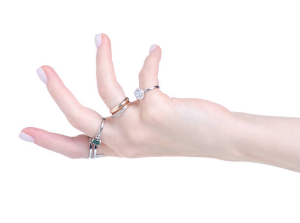istock Female hand with many rings 1296353816
