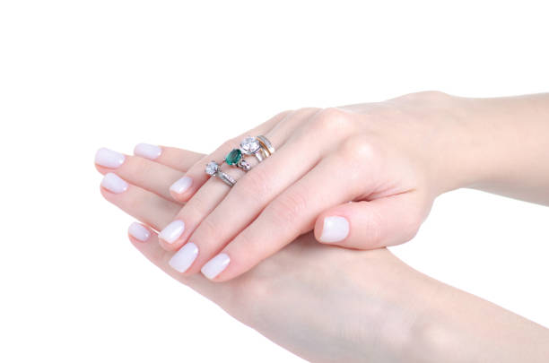 istock Female hand with many rings 1296353818