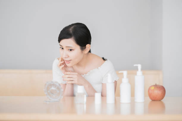 istock Asian woman touching the skin 1296354041