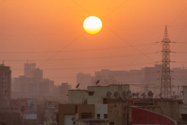Sun sets behind a cityscape of Mumbai