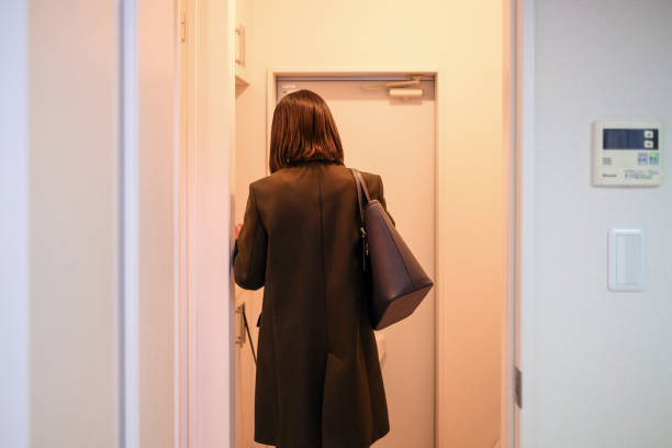 istock Rear view of businesswoman going to work 1296356911