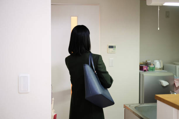 istock Rear view of businesswoman going to work 1296357042