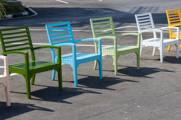 colorful wooden chairs. a row of colorful chairs. colorful wooden chairs on various background, can be use for background or prints. - 13571 imagens e fotografias de stock