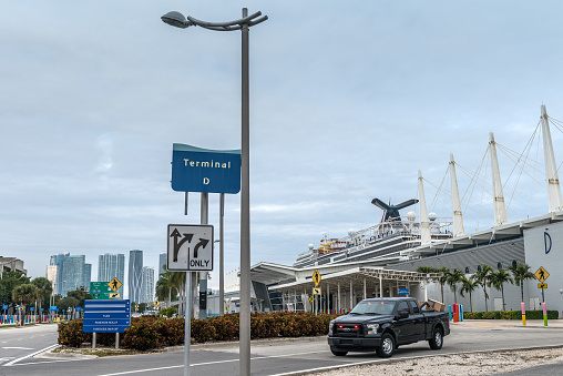 Miami, FL, USA - January 14, 2021: Cruise stopped by terminal D of the port, due to the global crisis of the Coronavirus epidemic (COVID-19), in the Port of Miami, one of the busiest ports in the United States.