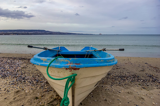 Close view of an empty boat on the sea beach