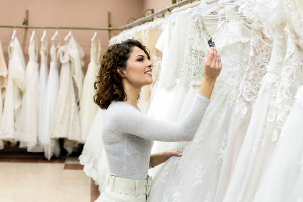 istock Young woman reading a label on a dress 1296361149
