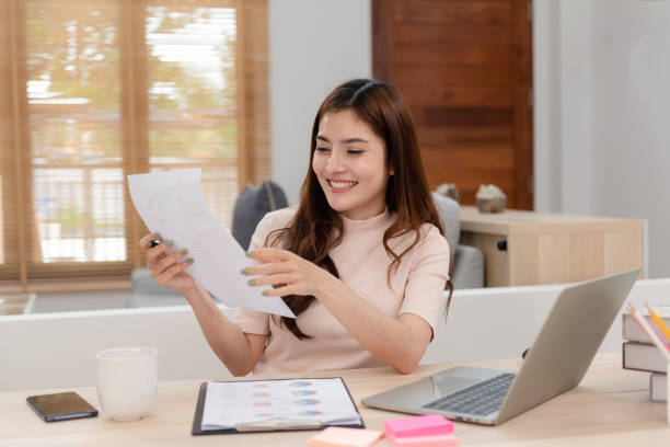 istock Work from home concept, a happy smiling beautiful Asian women Working at desktop computer laptop It is a new normal lifestyle of the online era. 1296362003