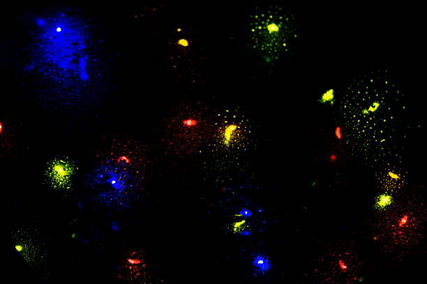 istock Colorful bokeh lights on a dark background 1296363065