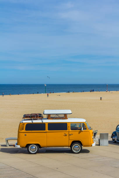 Scheveningen beach, the Netherlands - May 21, 2017: orange VW combi camper wagen at Aircooled classic car show