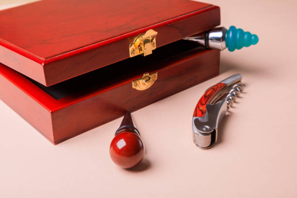 istock Wine corks and bottle openers set in a wooden box. 1296365840