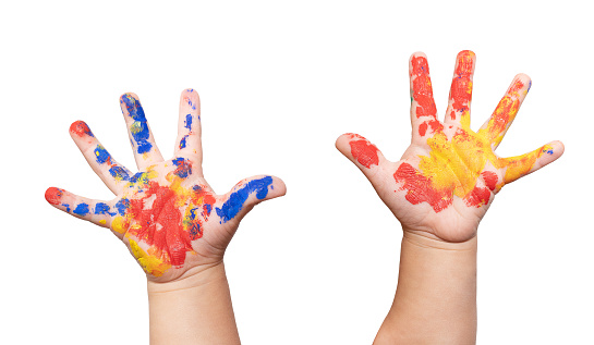 Children's hands in paint isolated on white.