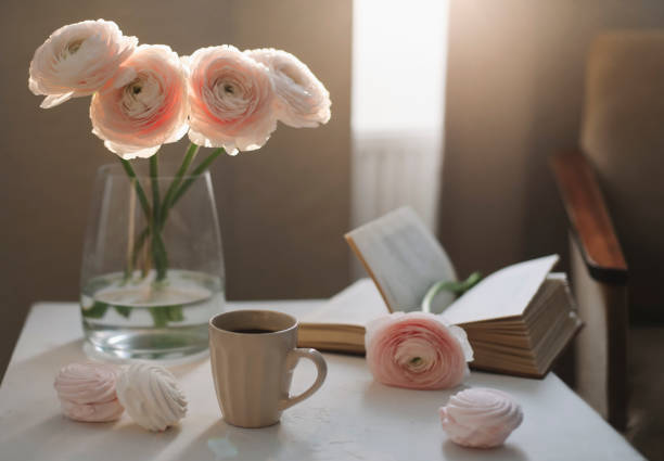 istock Spring romantic still life with flowers, coffee cup and marshmallow. Stylish flat lay. Home decoration. 1296367932