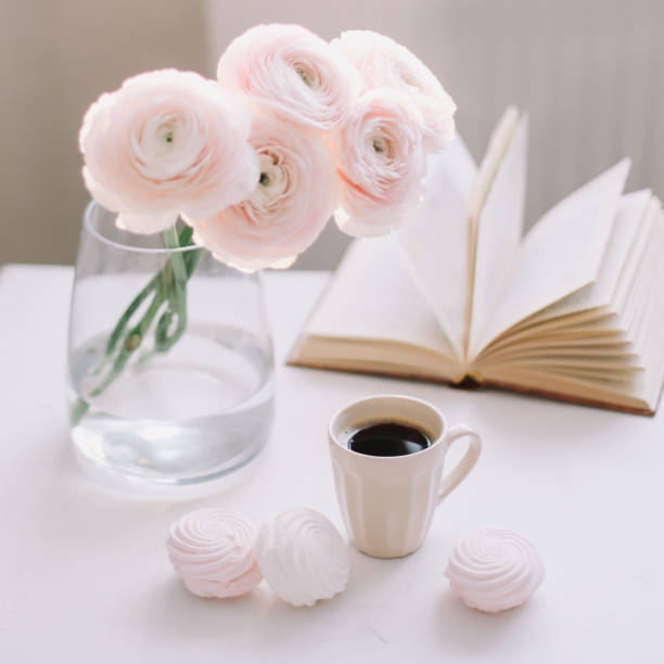 istock Spring romantic still life with flowers, coffee cup and marshmallow. Stylish flat lay. Home decoration. 1296367939