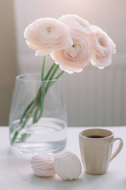 istock Spring romantic still life with flowers, coffee cup and marshmallow. Stylish flat lay. Home decoration. 1296367944