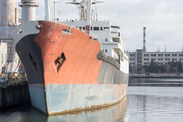 istock Old ship near the pier in the port. 1296368041