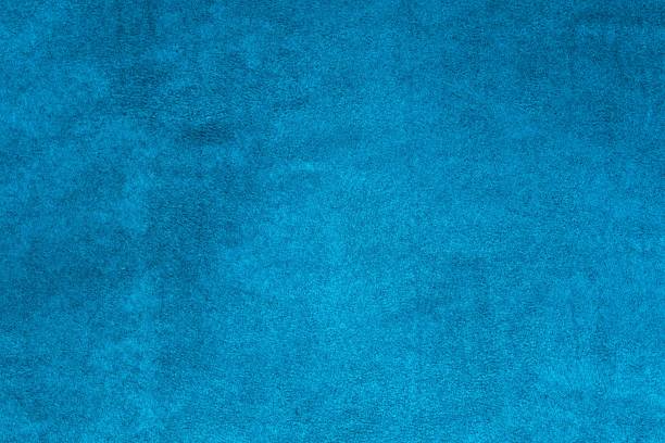 istock Background texture of upholstery velvety fabric in blue green color. 1296368043
