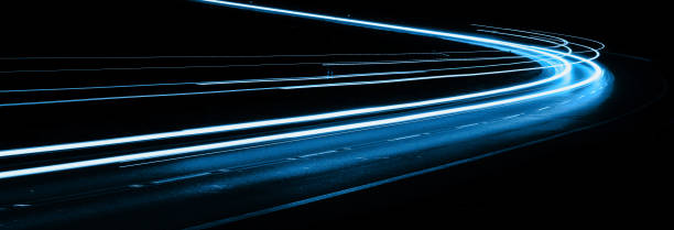 istock blue car lights at night. long exposure 1296372043