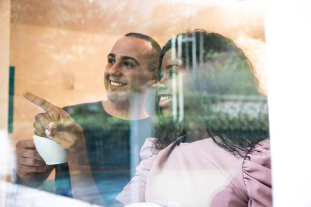 istock Lovely couple enjoy a coffee at home 1296372044