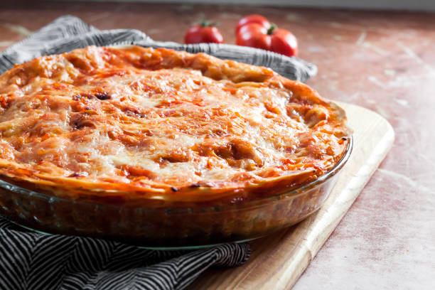 istock Homemade lasagna in round glass baking dish 1296372143