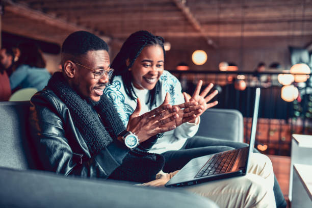 istock African Couple Enjoying Lap Top Video Conference Together 1296372610