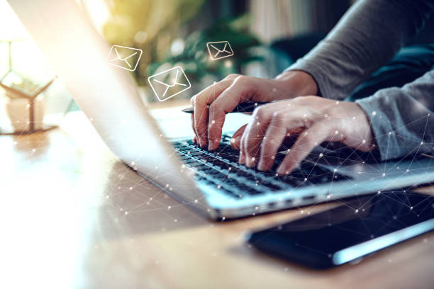 istock Closeup Woman hand using Laptop pc with email icon, Work from home, Email concept 1296372937